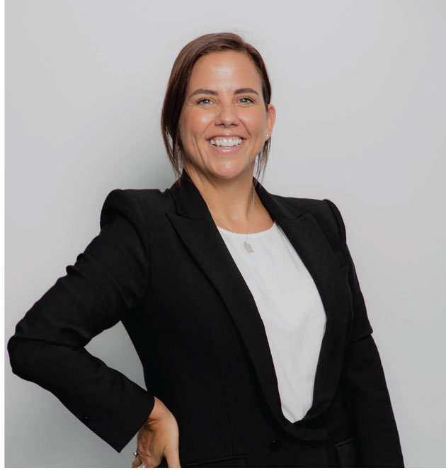 Holly Hardstaff, legal professional at Croy Legal, smiling confidently in a black blazer with a white top.